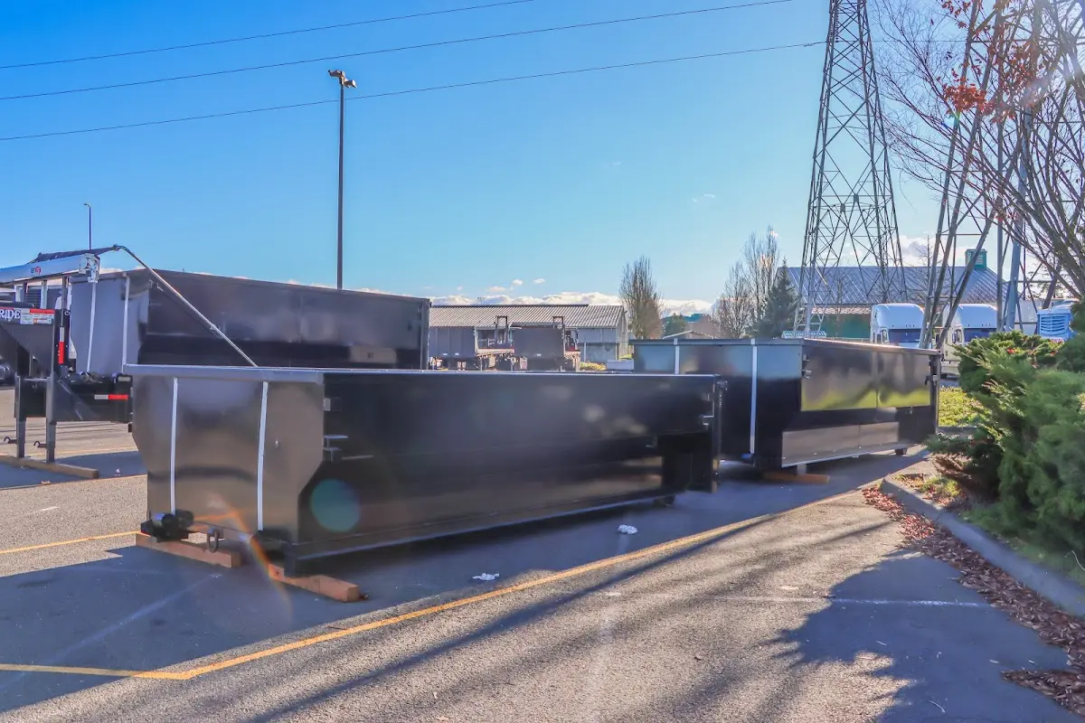 Roll-off dumpster ready for waste disposal at job site for 2 Yard Dumpster Rental in Athens